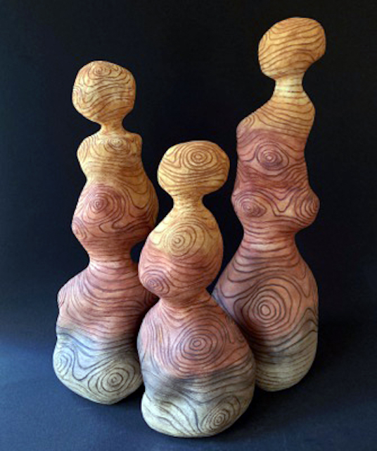 three abstract figures